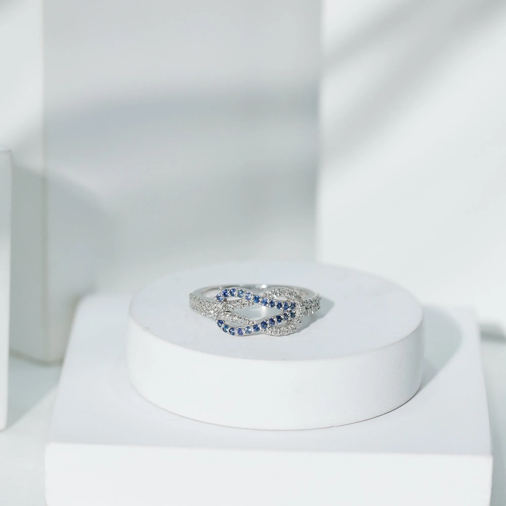 Blue Sapphire And Diamond Interlock Infinity Ring