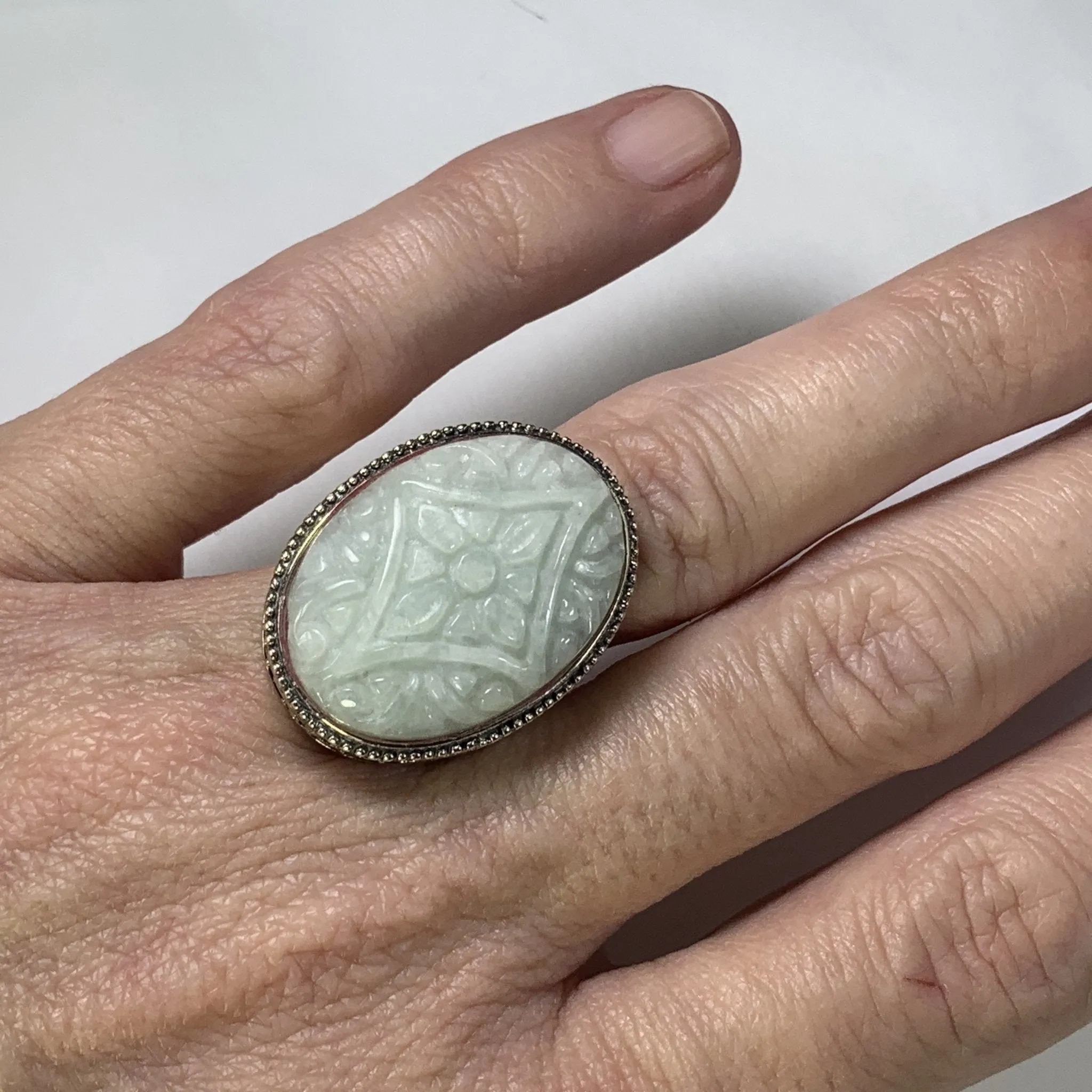 Vintage Jade Statement Ring in a Milgrain Sterling Silver Setting. Light Green Jade has Floral Etching.